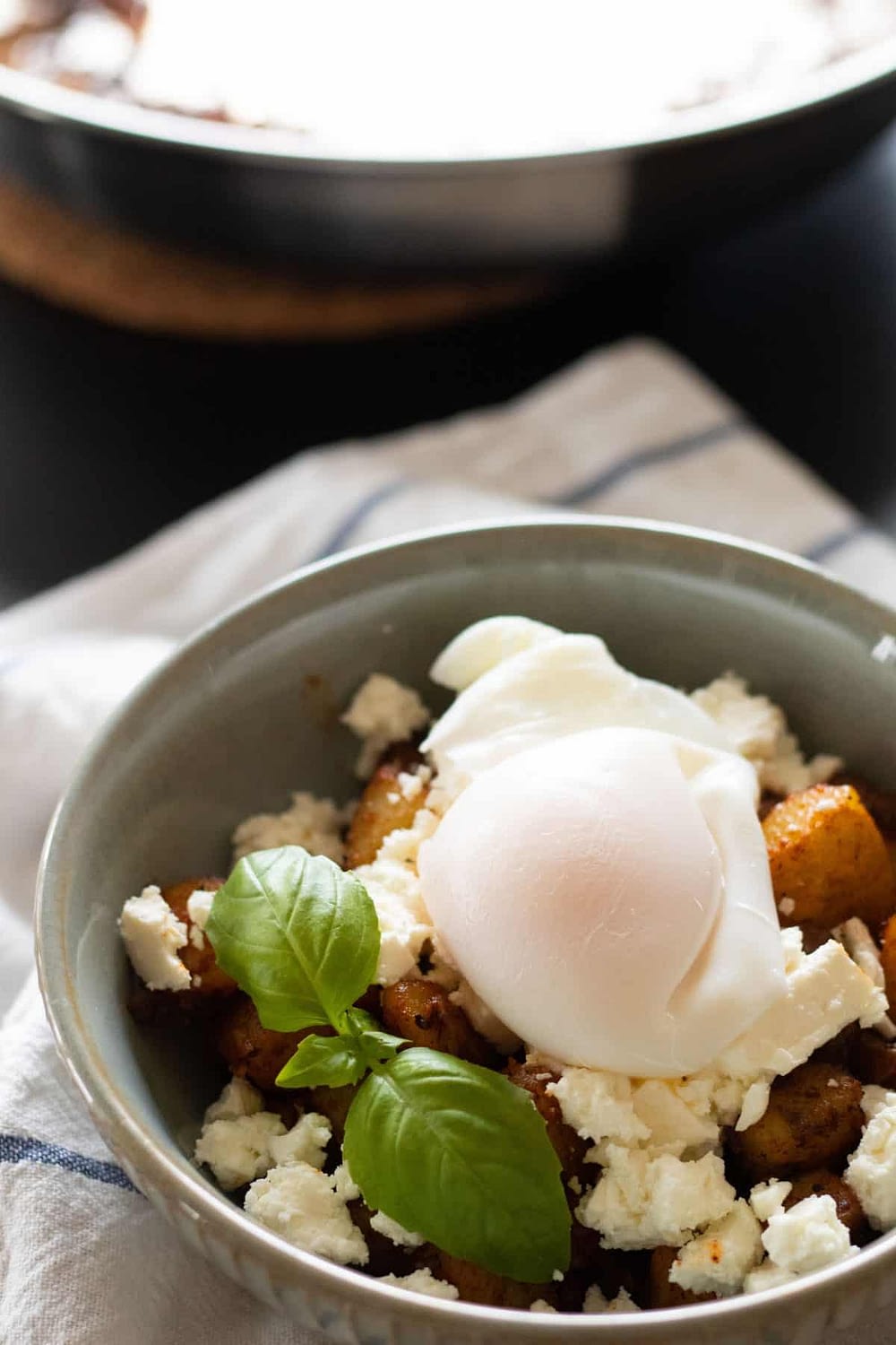 Fried Potatoes Breakfast Bowl with Feta Cheese & Poached Egg